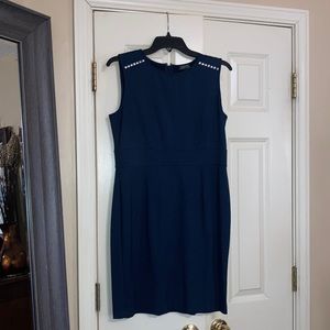 Dark blue pretty dress that’s fitted at the waist.